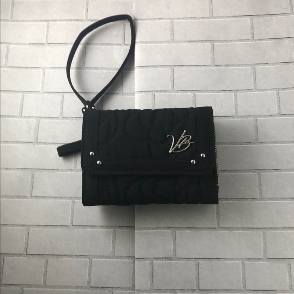 Vera Bradley Magnetic wallet with zipper.